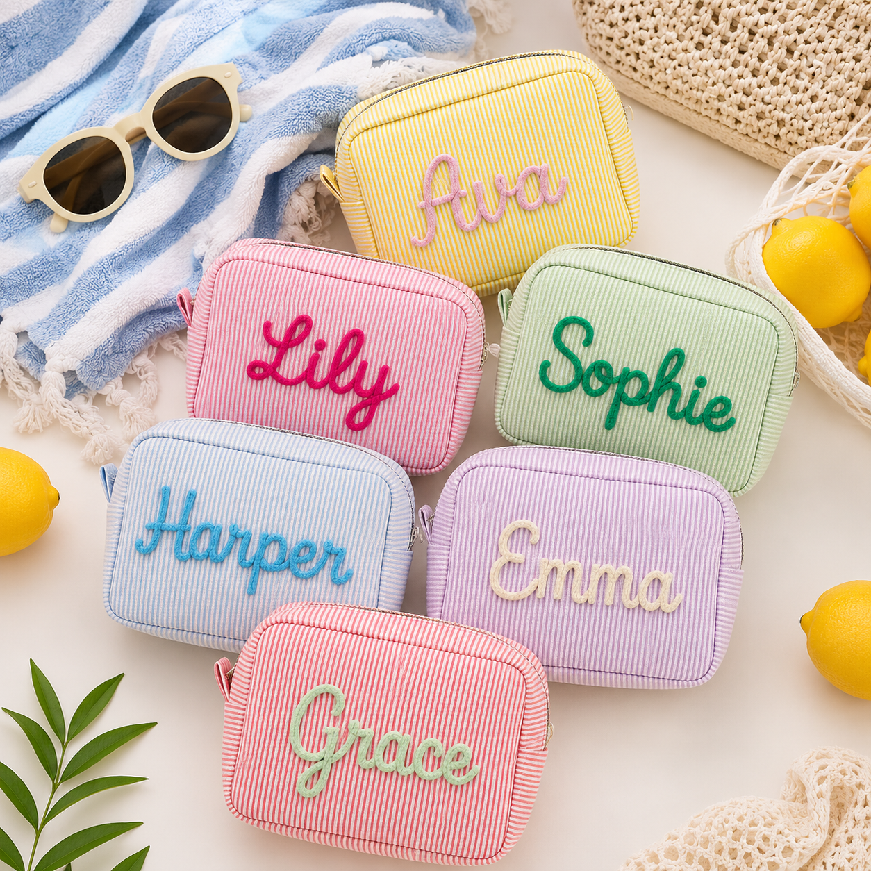 Personalized seersucker makeup bags with embroidered names in pastel colors