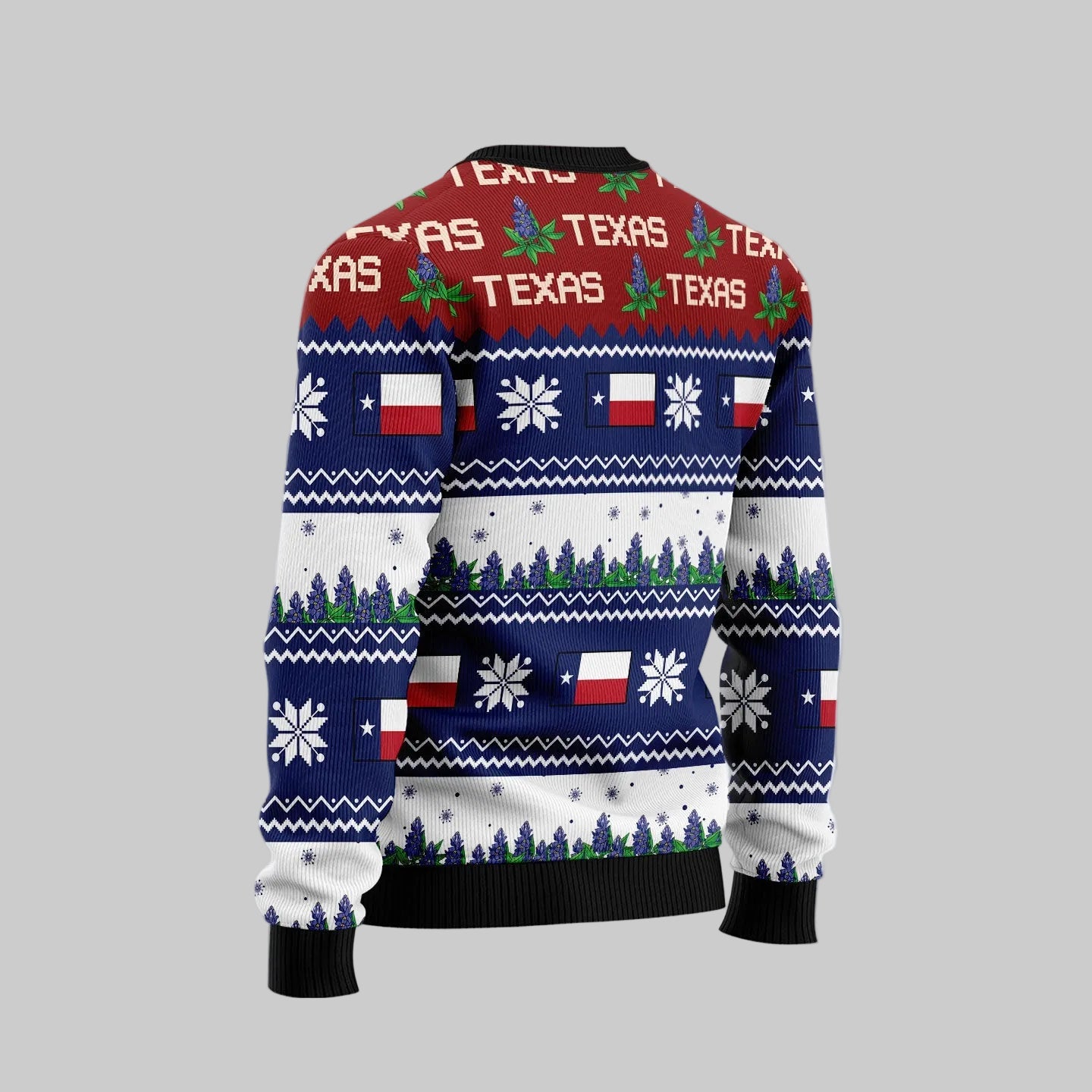A long-sleeve Christmas sweater shown from the back, featuring a festive holiday knit pattern with the word 'TEXAS' repeated across a red band, Texas flag motifs, snowflakes, pine trees, and dark navy ribbed cuffs and hem. The background is a soft light gray with white snowflakes and a pinkish glow, plus a circular shark logo watermark in the top left.