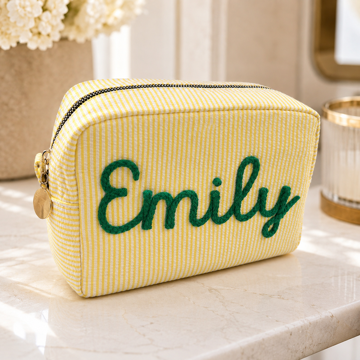 Yellow personalized seersucker makeup bag with green embroidered name Emily