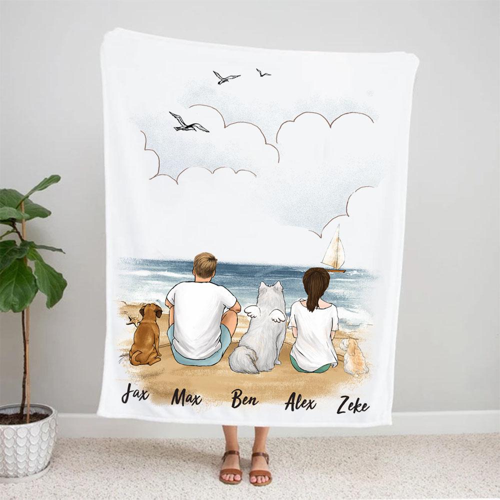 dog and dog owner sitting on beach fleece blanket gift for dog lovers