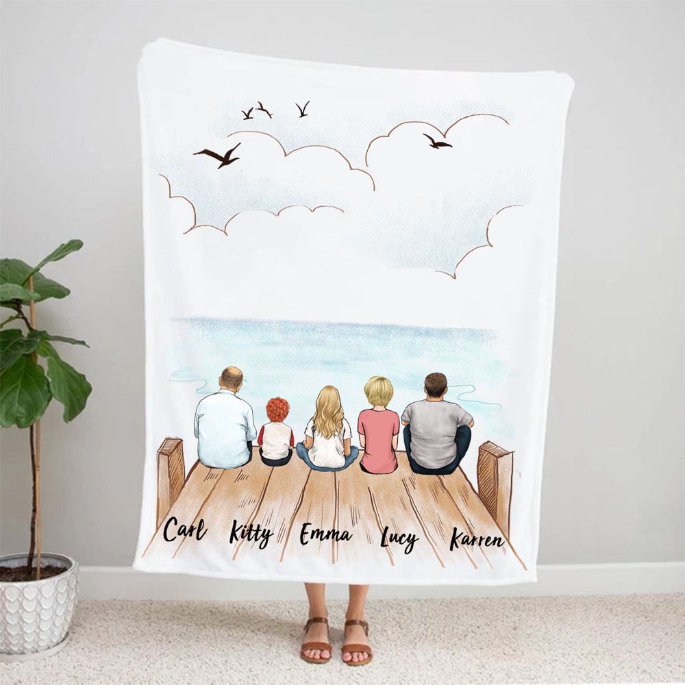 fleece blanket gift for the whole family with up to 5 members sitting on wooden dock