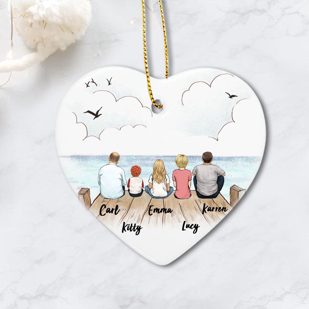 heart ornament gift for the whole family with up to 5 members sitting on wooden dock
